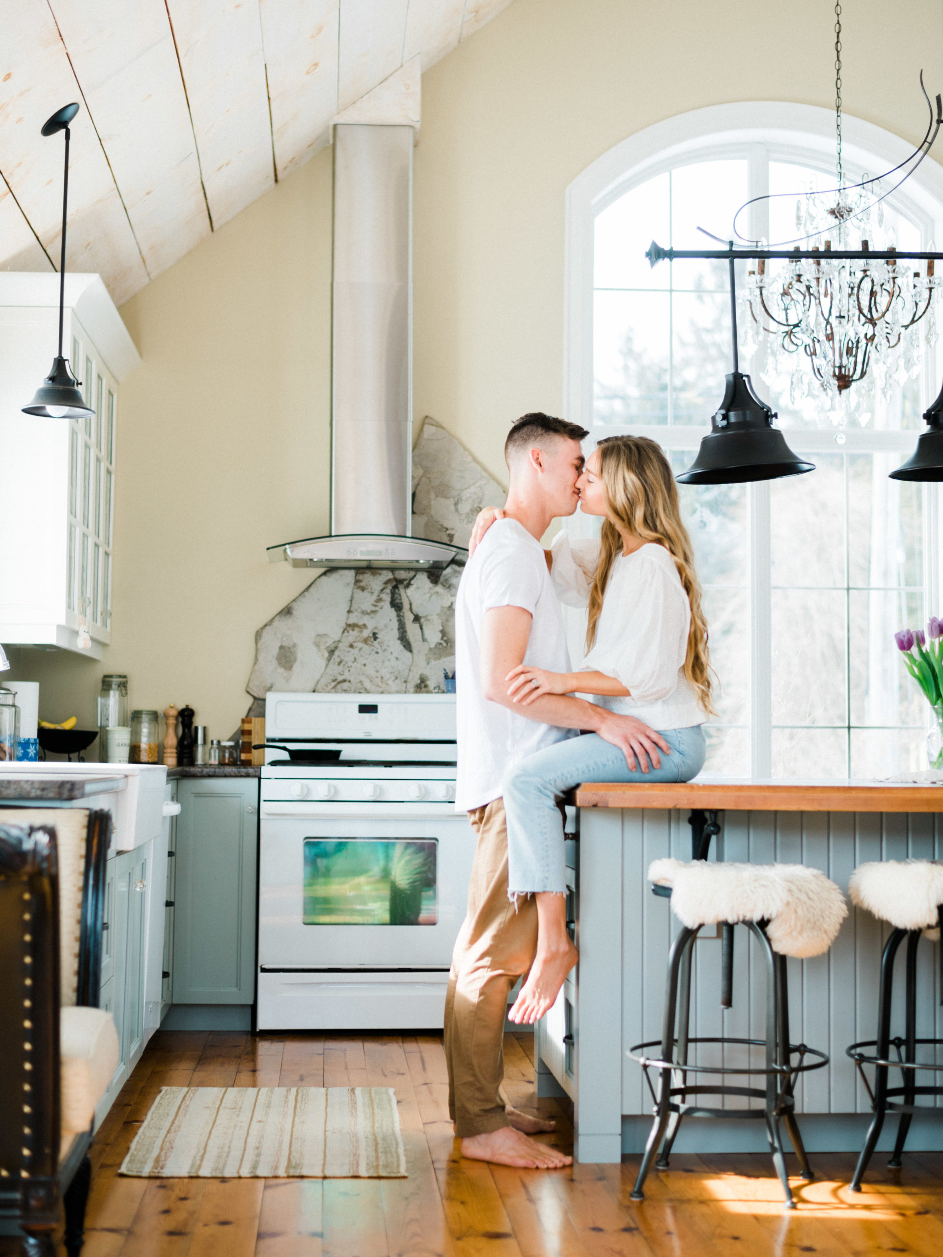 Lifestyle engagement session in luxury kitchen at Woodland Weddings