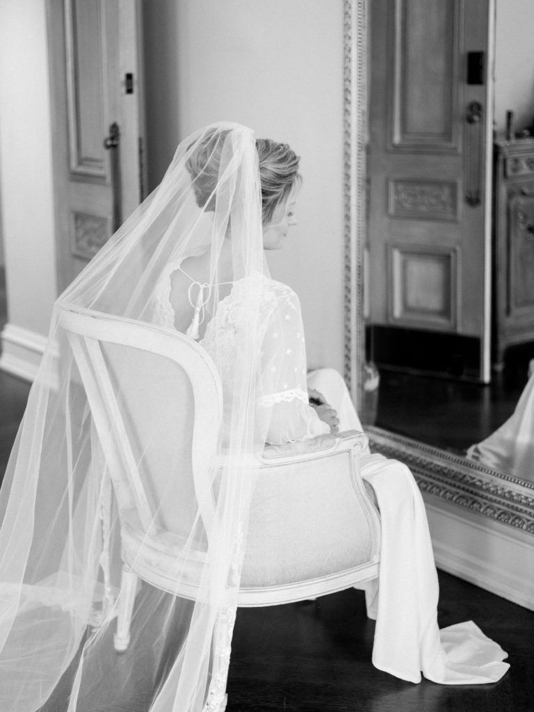 Fine Art bride with veil getting ready at the Park Chateau in New Brunswick photographed in black and white by Liz Andolina Photography