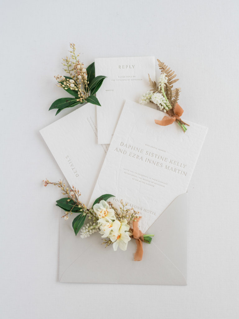 Stunning fine art wedding flat lay with Isidore Augustine stationery and Winsome Floral bouts photographed by Liz Andolina Photography