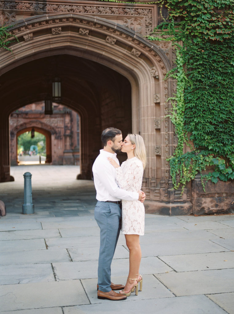 Couple kiss during their engagement session at Princeton University by Liz Andolina Photography