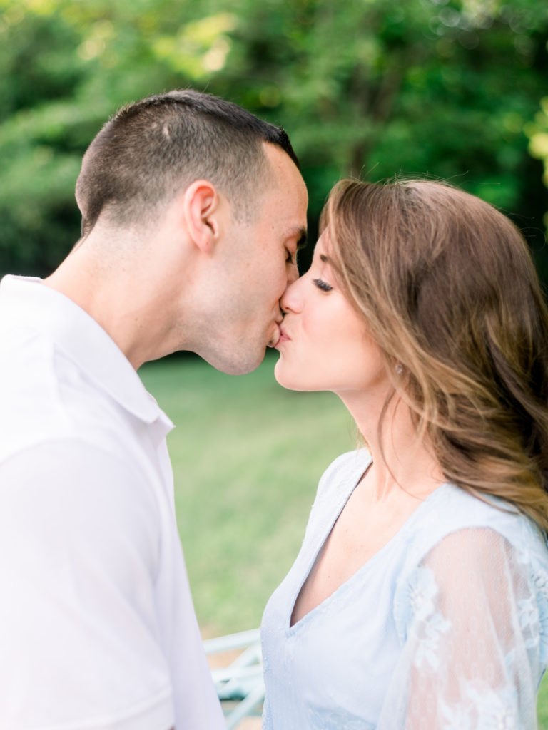 Couple shares a kiss during their engagement session at Sayen House & Gardens by Liz Andolina Photography