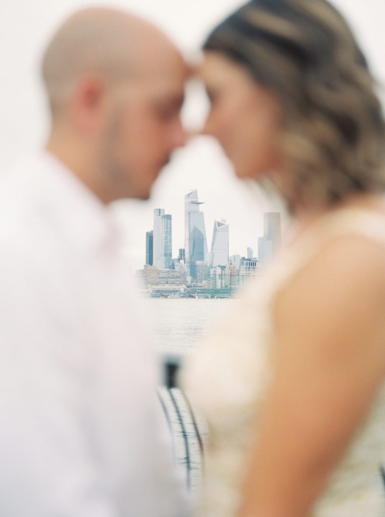 Couple shares a romantic moment at Pier A Park in Hoboken, New Jersey