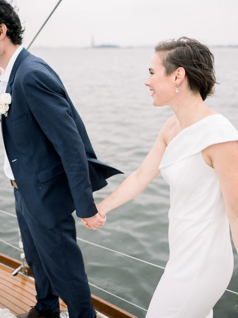 Bride and groom on sailboat in Brooklyn