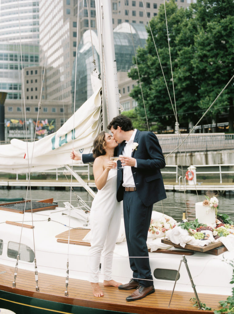 Bride and groom on sailboat in Brooklyn