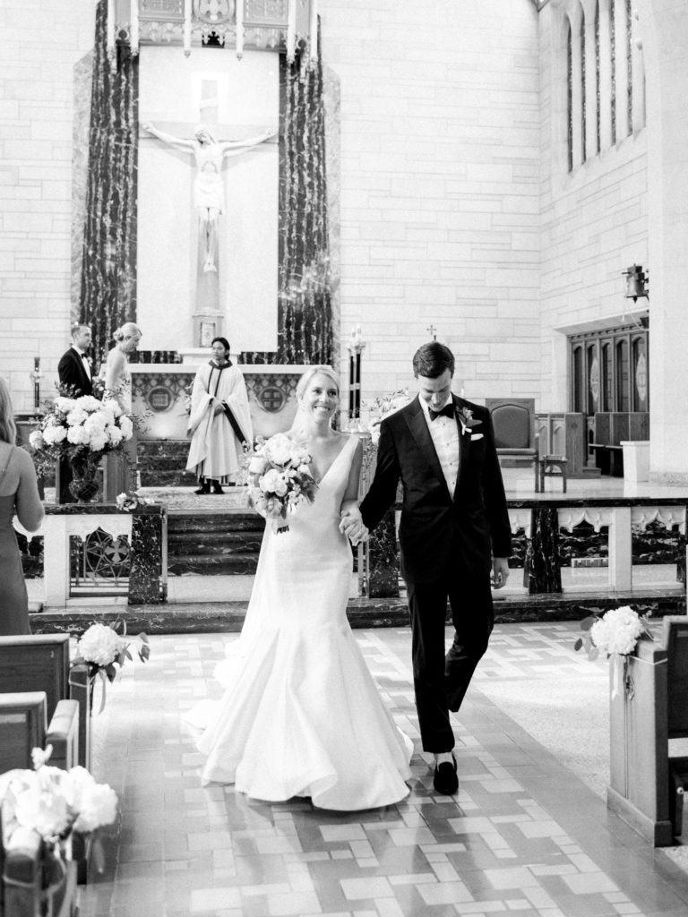 Bride and groom walk down the aisle at St Paul's Church in Princeton