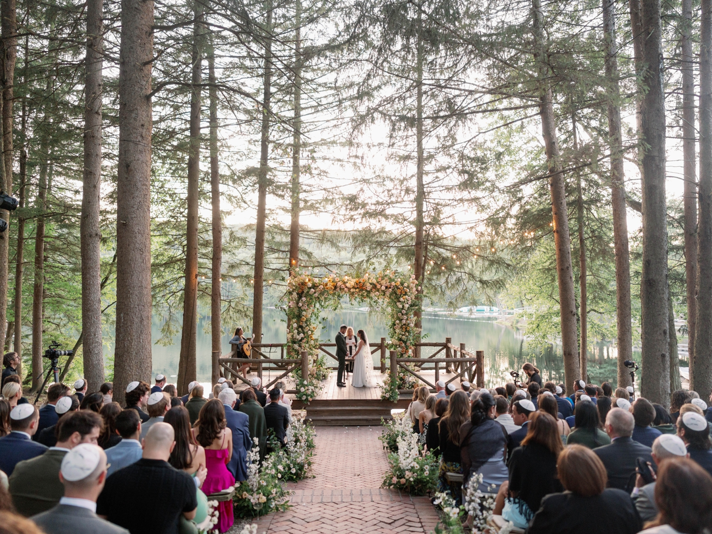 Outdoor wedding ceremony overlooking the lake at Cedar Lakes Estate