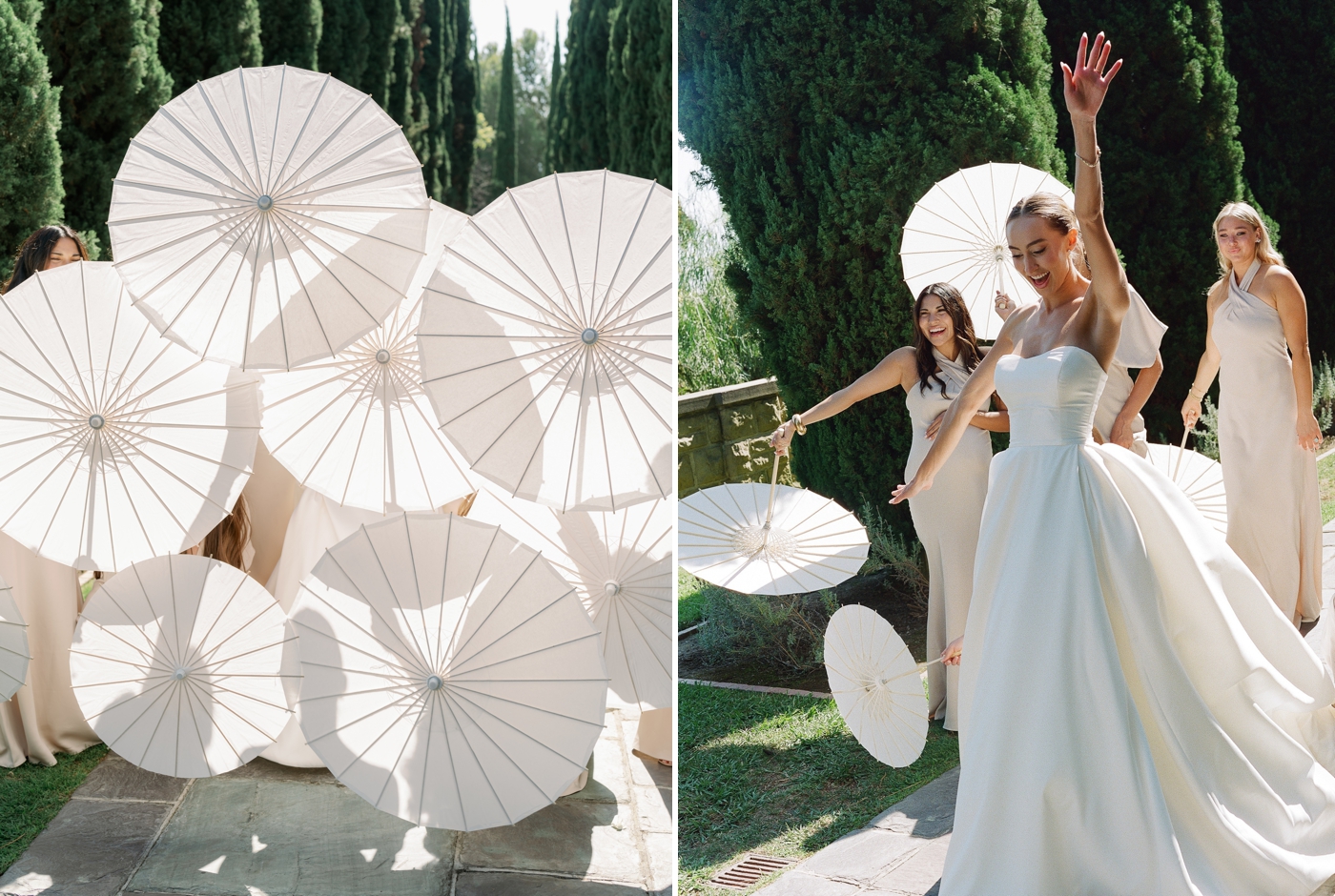 Bride and bridesmaids holding parisols towards camera to block themselves 