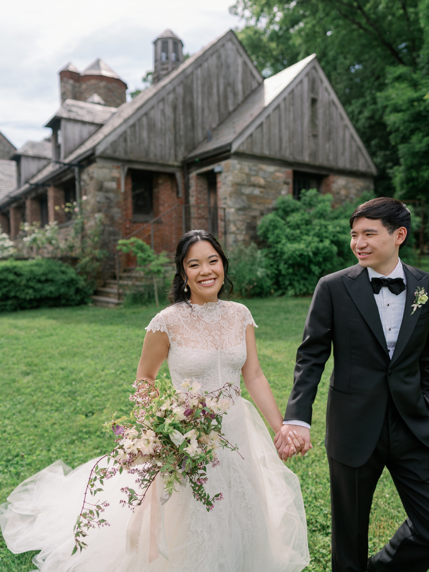 Bride and groom walking hand in hand at Blue Hill Farms